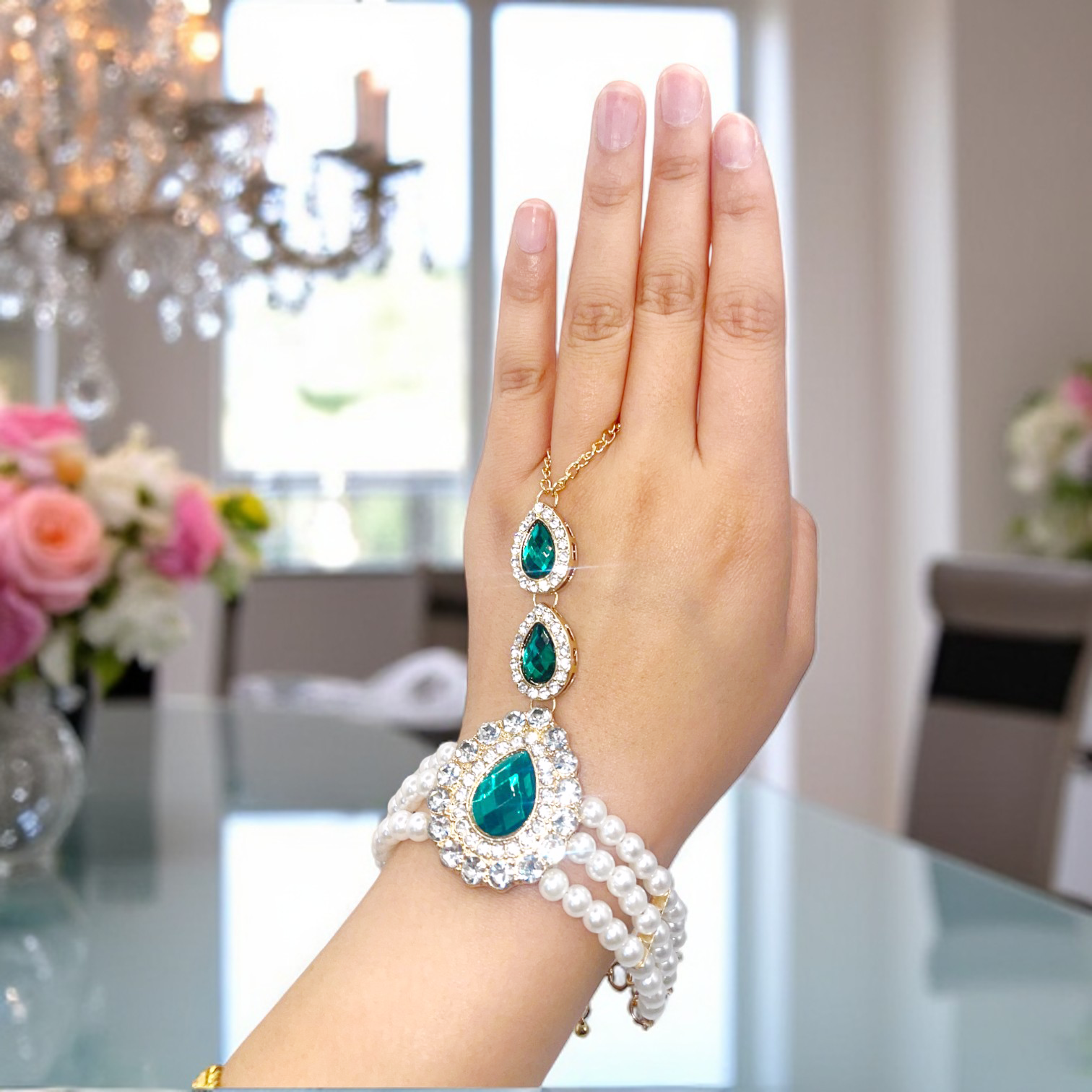 Emerald Pearl Hand Chain Bracelet – Elegant hand chain bracelet with emerald stones and pearls, perfect for weddings and special occasions.